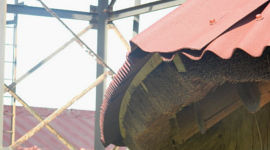 Onduline bending to thatch roof when oversheeting