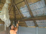 Fire retardant spray applied to inside of roof as fire protection
