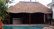 Thatch lapa and entertainment area by swimming pool
